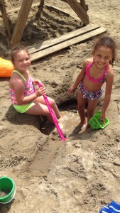 girls playing in sand