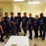 Modeling their Joseph's House shirts in the dining room.