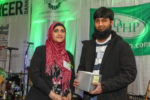 Uzma Popal and Saad Khan with the award for the Muslim Soup Kitchen Project.